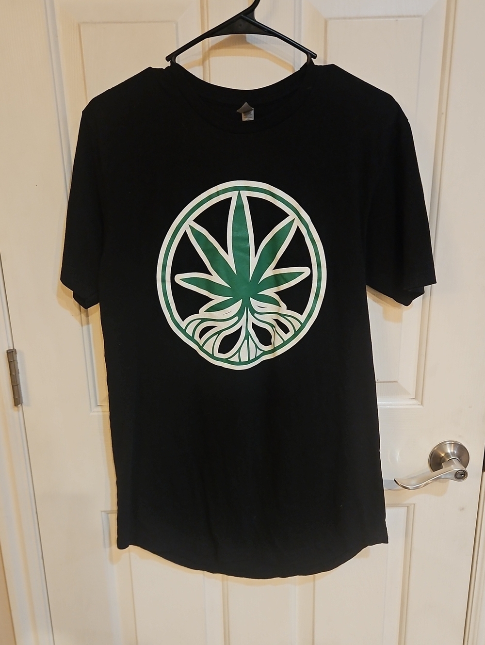 Next Level Apparel Black Tee with Green Leaf Emblem